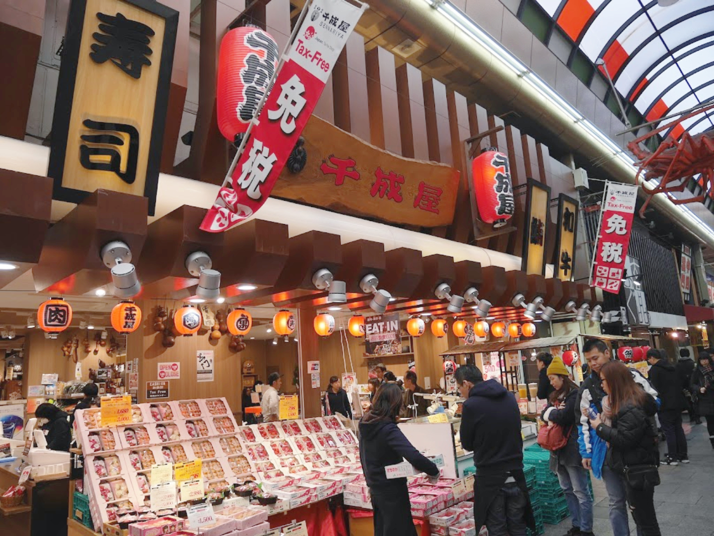 Image of an open sushi place with many pre-main boxes in the front ready for customers to take.